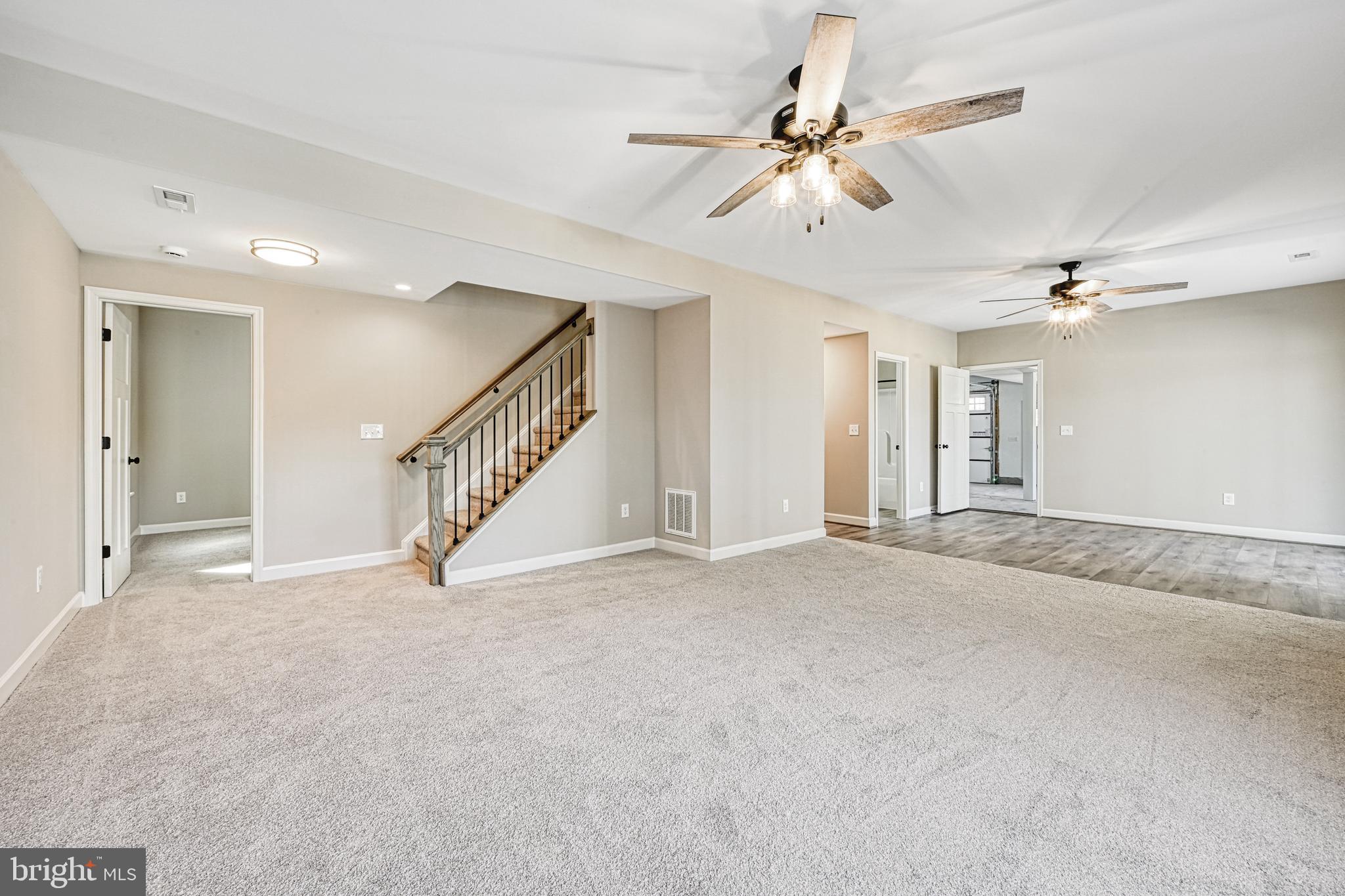 48 Pine Drive Louisa, VA 23093 - Photo 44 of 76 a view of an empty room with a ceiling fan