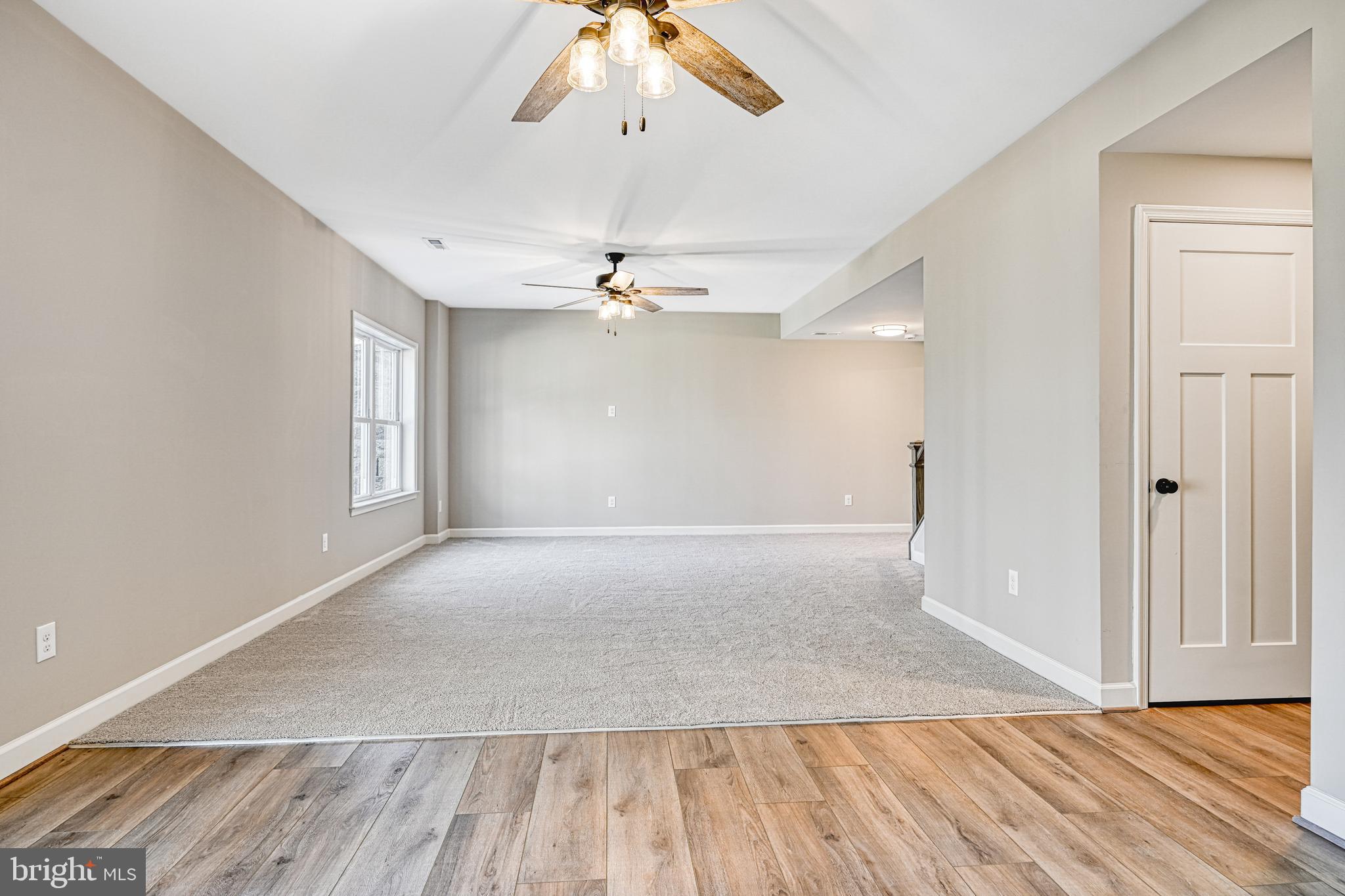 48 Pine Drive Louisa, VA 23093 - Photo 45 of 76 wooden floor in an empty room with a window