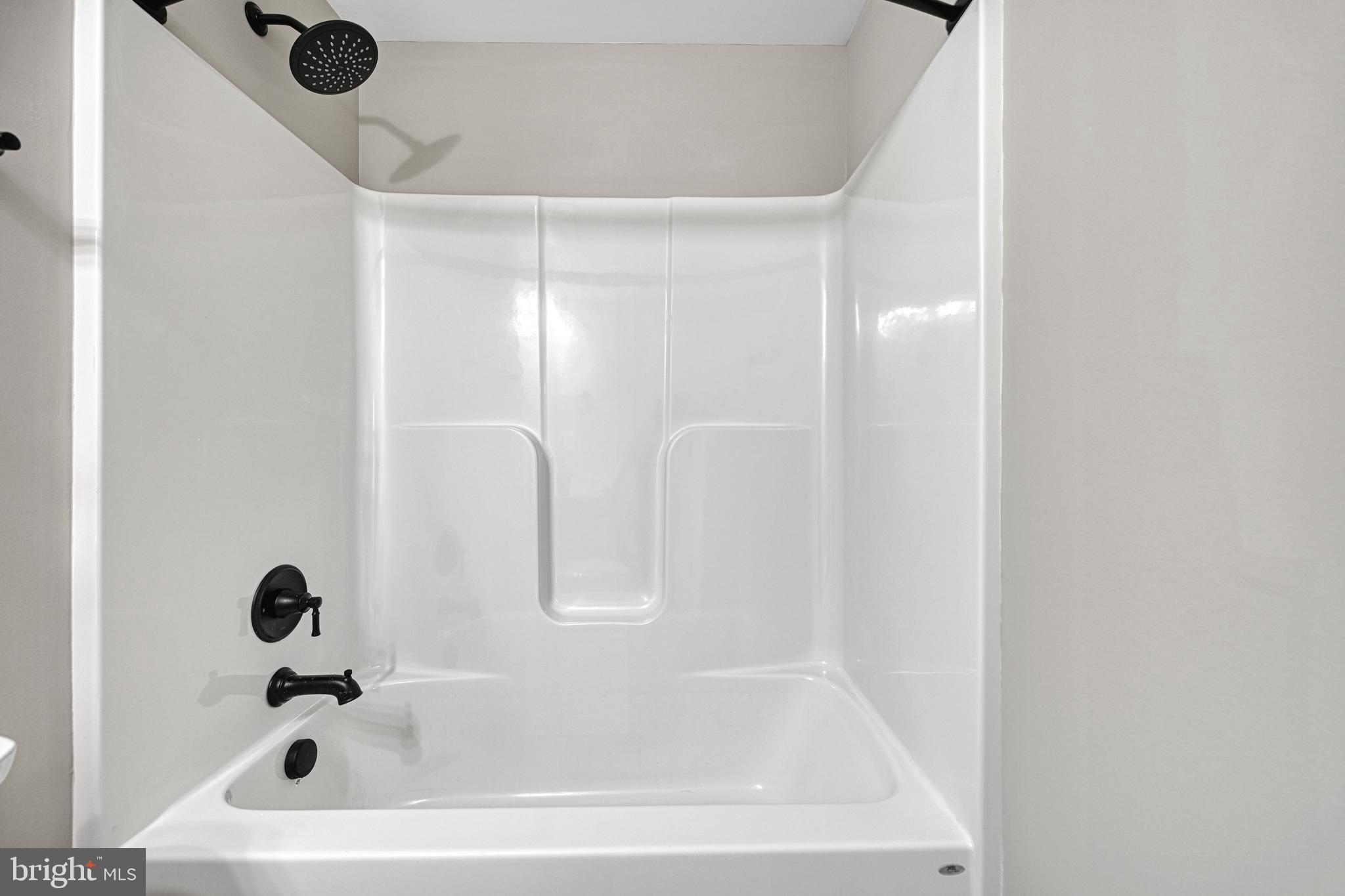 48 Pine Drive Louisa, VA 23093 - Photo 50 of 76 a white bath tub sitting next to a white sink