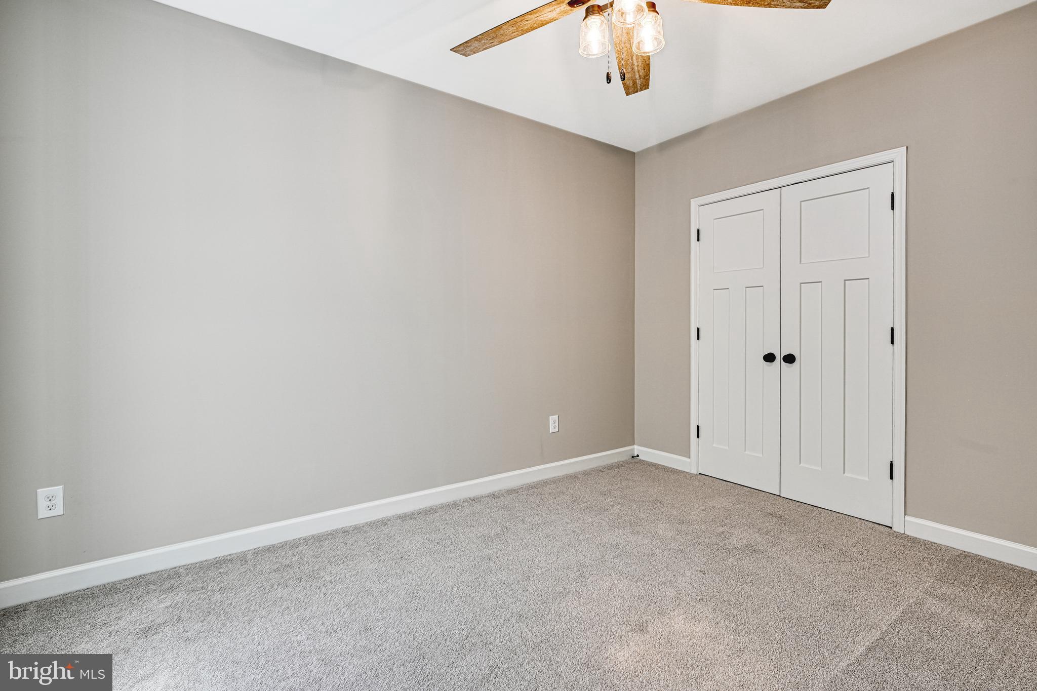 48 Pine Drive Louisa, VA 23093 - Photo 55 of 76 a view of an empty room and chandelier fan