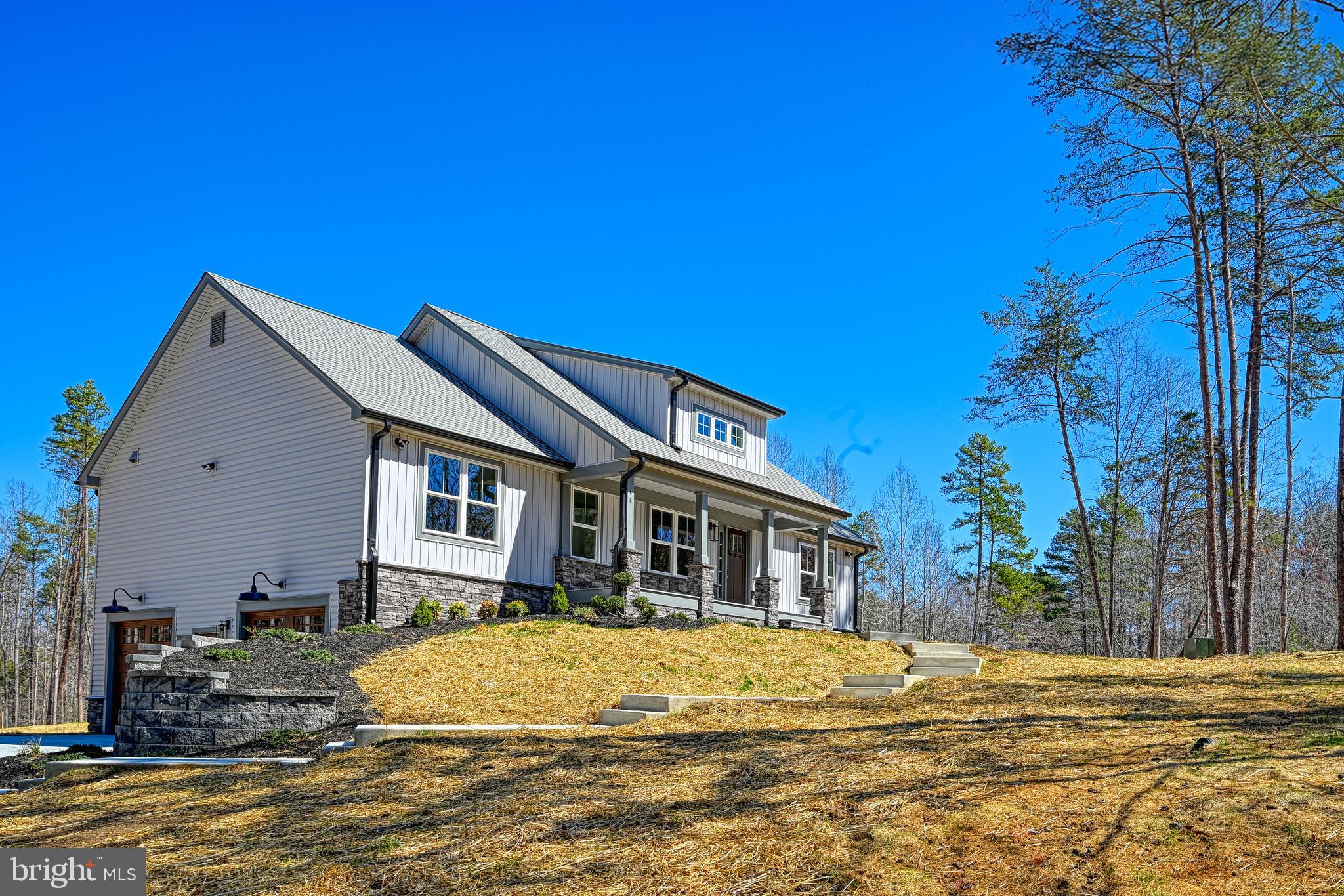 48 Pine Drive Louisa, VA 23093 - Photo 60 of 76 a front view of a house with a garden