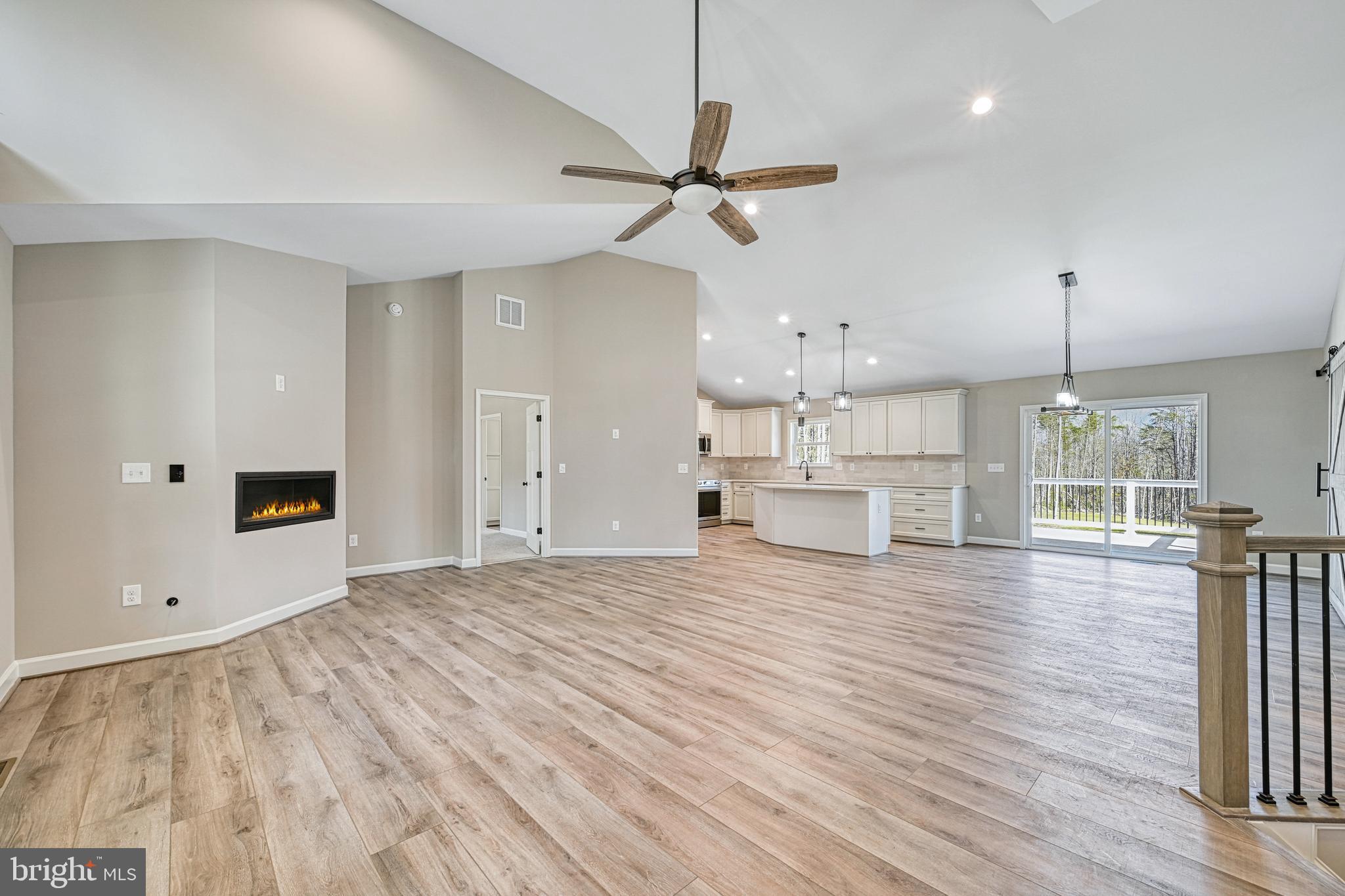 48 Pine Drive Louisa, VA 23093 - Photo 6 of 76 a view of empty room with wooden floor and ceiling fan