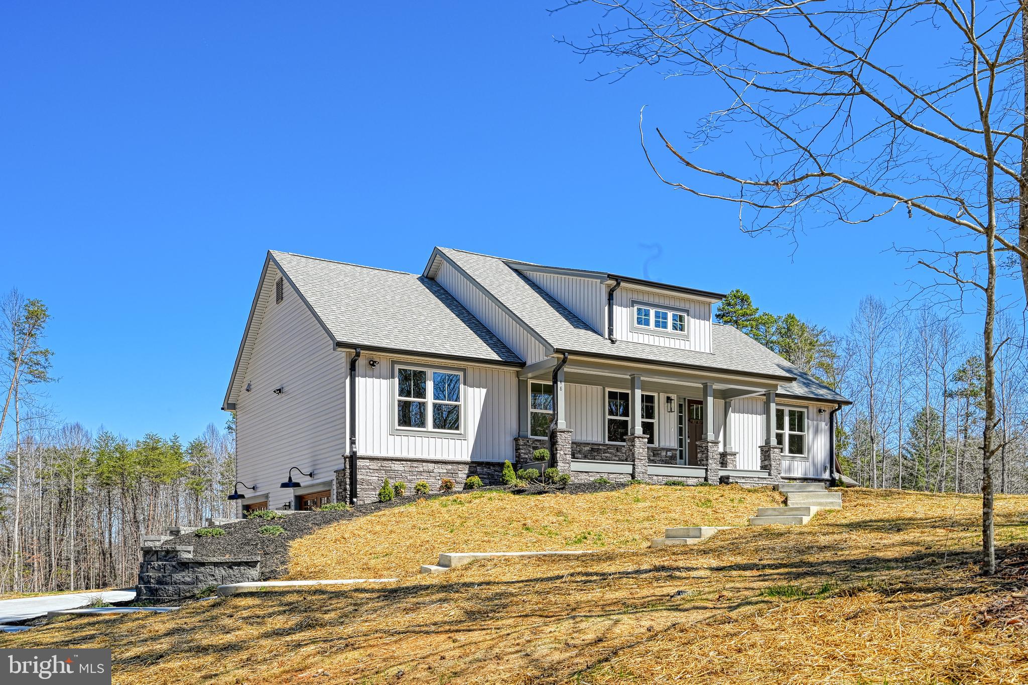 48 Pine Drive Louisa, VA 23093 - Photo 61 of 76 a front view of a house with a ocean view
