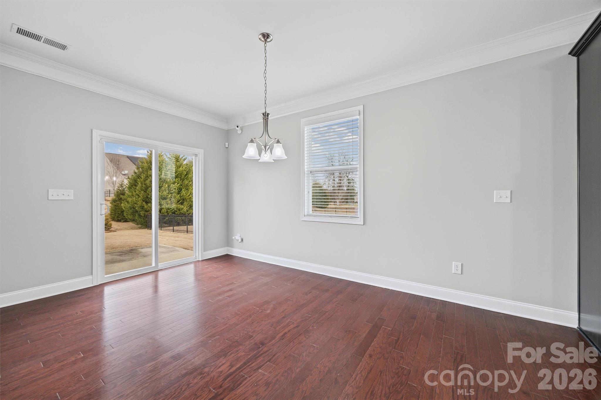 1129 Black Walnut Road Clover, SC 29710 - Photo 17 of 40 a view of an empty room with wooden floor and a window