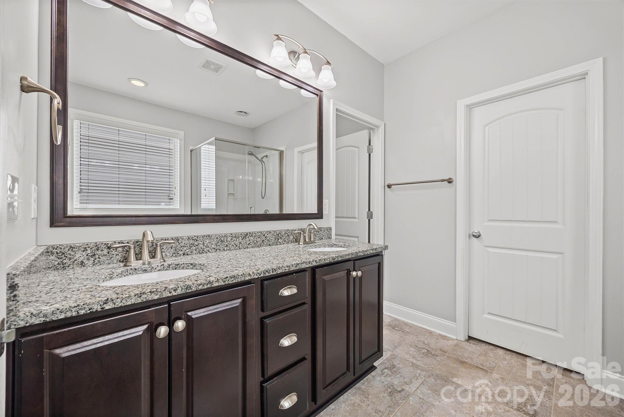 1129 Black Walnut Road Clover, SC 29710 - Photo 26 of 40 a bathroom with a granite countertop sink a mirror and a