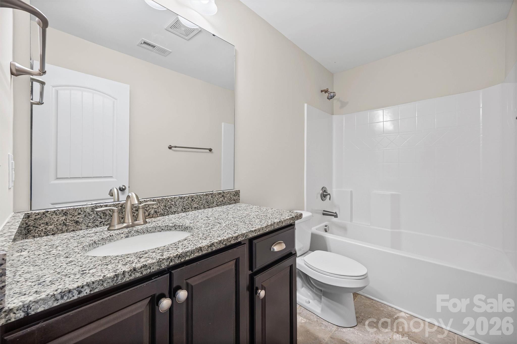 1129 Black Walnut Road Clover, SC 29710 - Photo 36 of 40 a bathroom with a granite countertop sink toilet and shower