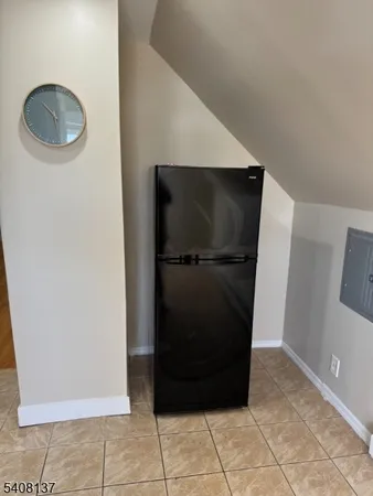 a view of a refrigerator in a kitchen