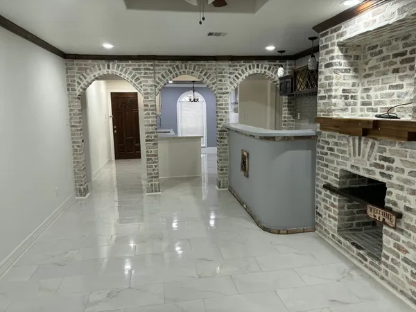 a view of lobby with furniture and a fireplace