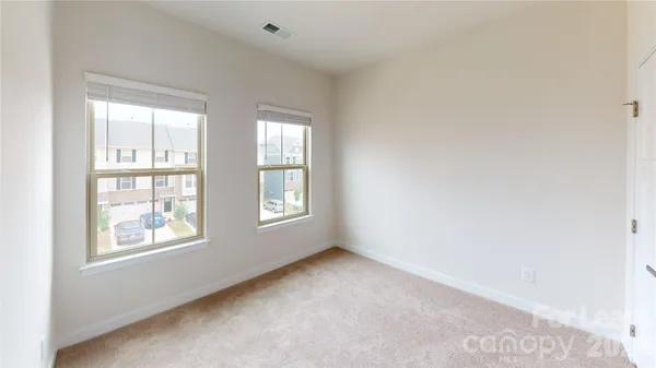 a bathroom with a toilet and shower