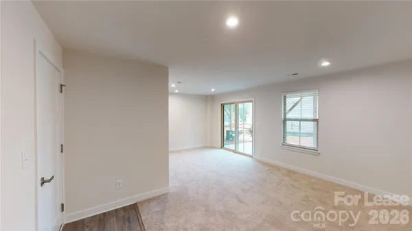 a view of a lake with table and chairs