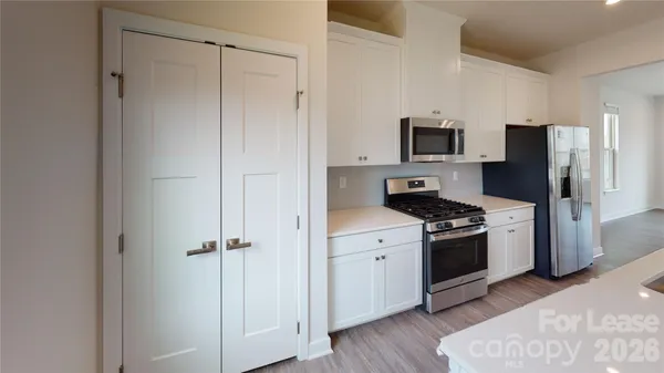 a kitchen with a refrigerator stove and sink