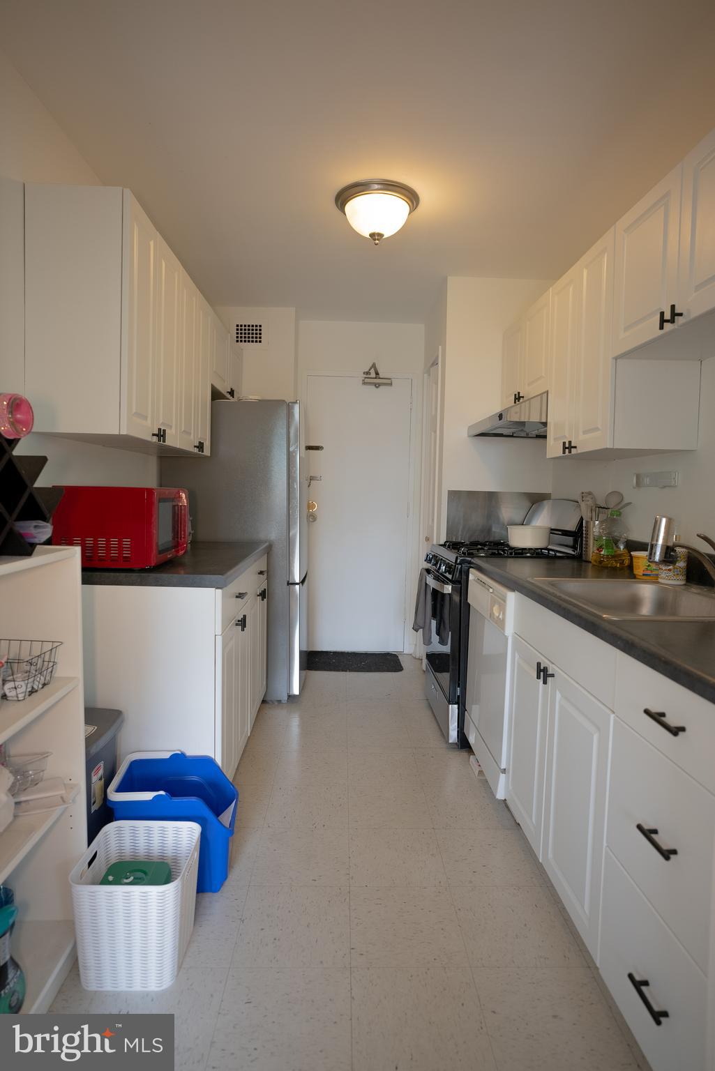 1900 Lyttonsville Road, Unit 514 Silver Spring, MD 20910 - Photo 5 of 5 a kitchen with stainless steel appliances granite countertop a sink refrigerator and cabinets