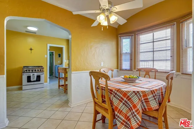 a dining room with furniture and chandelier