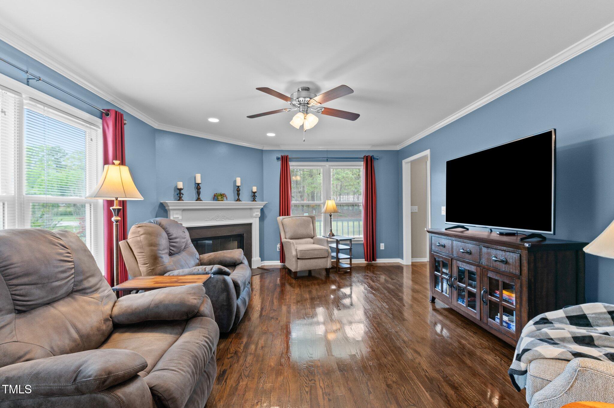 4810 Mitchell Mill Road Wake Forest, NC 27587 - Photo 11 of 35 a living room with furniture and a flat screen tv