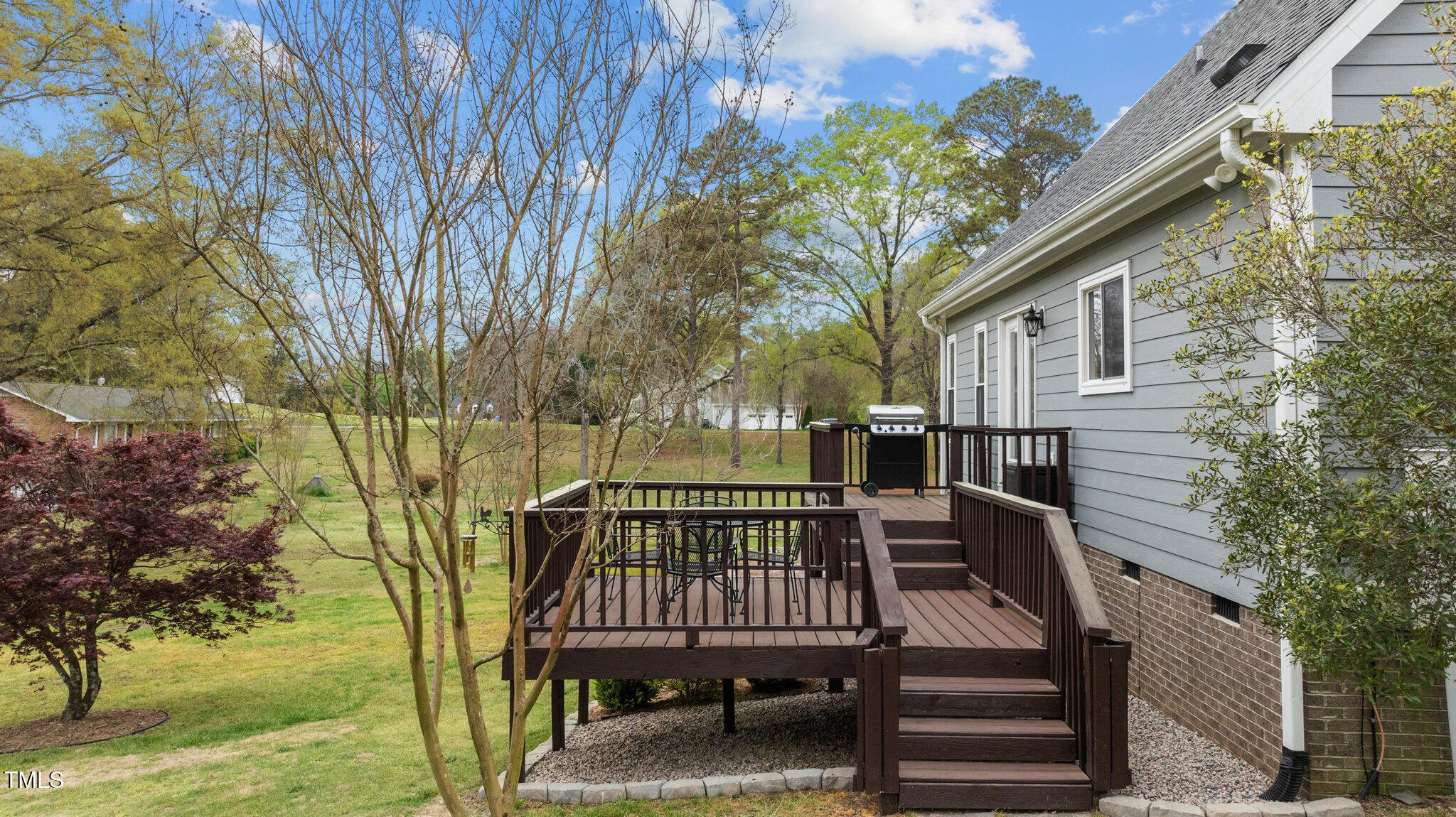 4810 Mitchell Mill Road Wake Forest, NC 27587 - Photo 26 of 35 a view of a wooden deck and a backyard