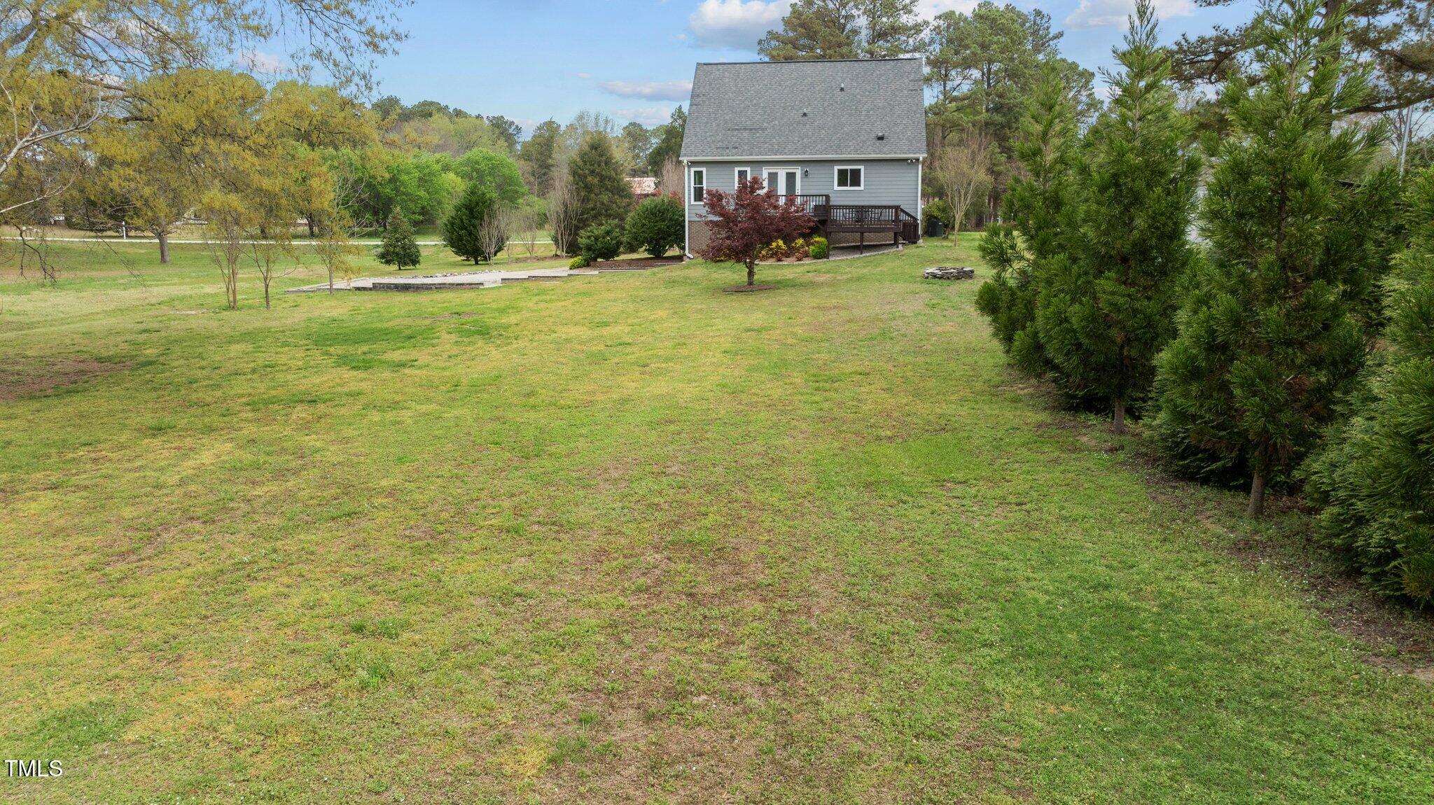 4810 Mitchell Mill Road Wake Forest, NC 27587 - Photo 29 of 35 a swimming pool with outdoor seating and yard