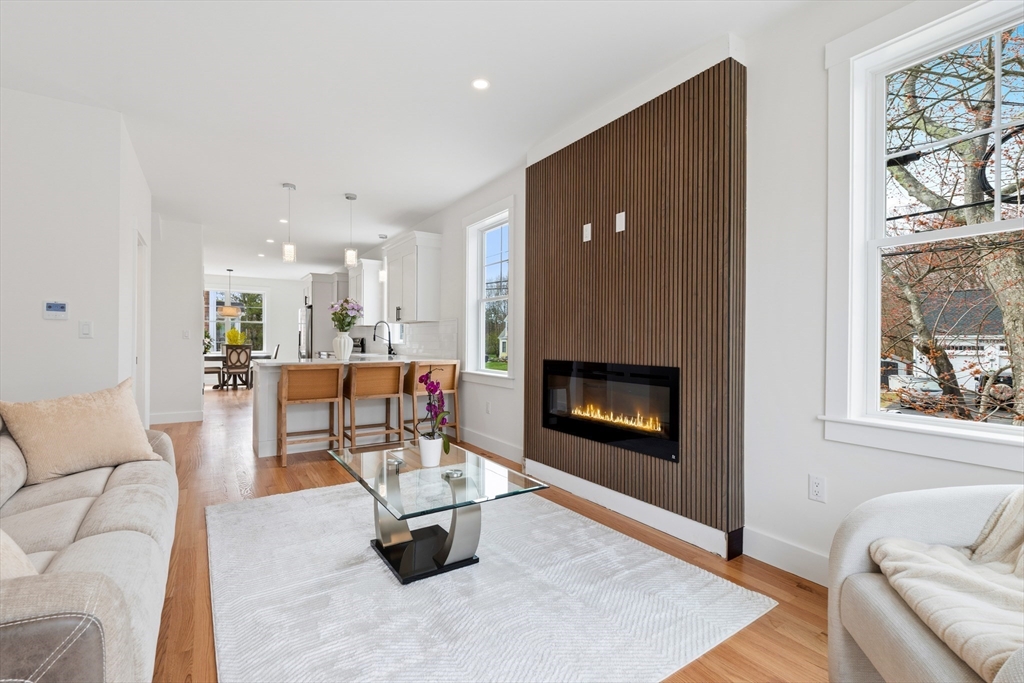 2 Old County Road, Unit 14 Salisbury, MA 01952 - Photo 2 of 33 a living room with furniture and a fireplace