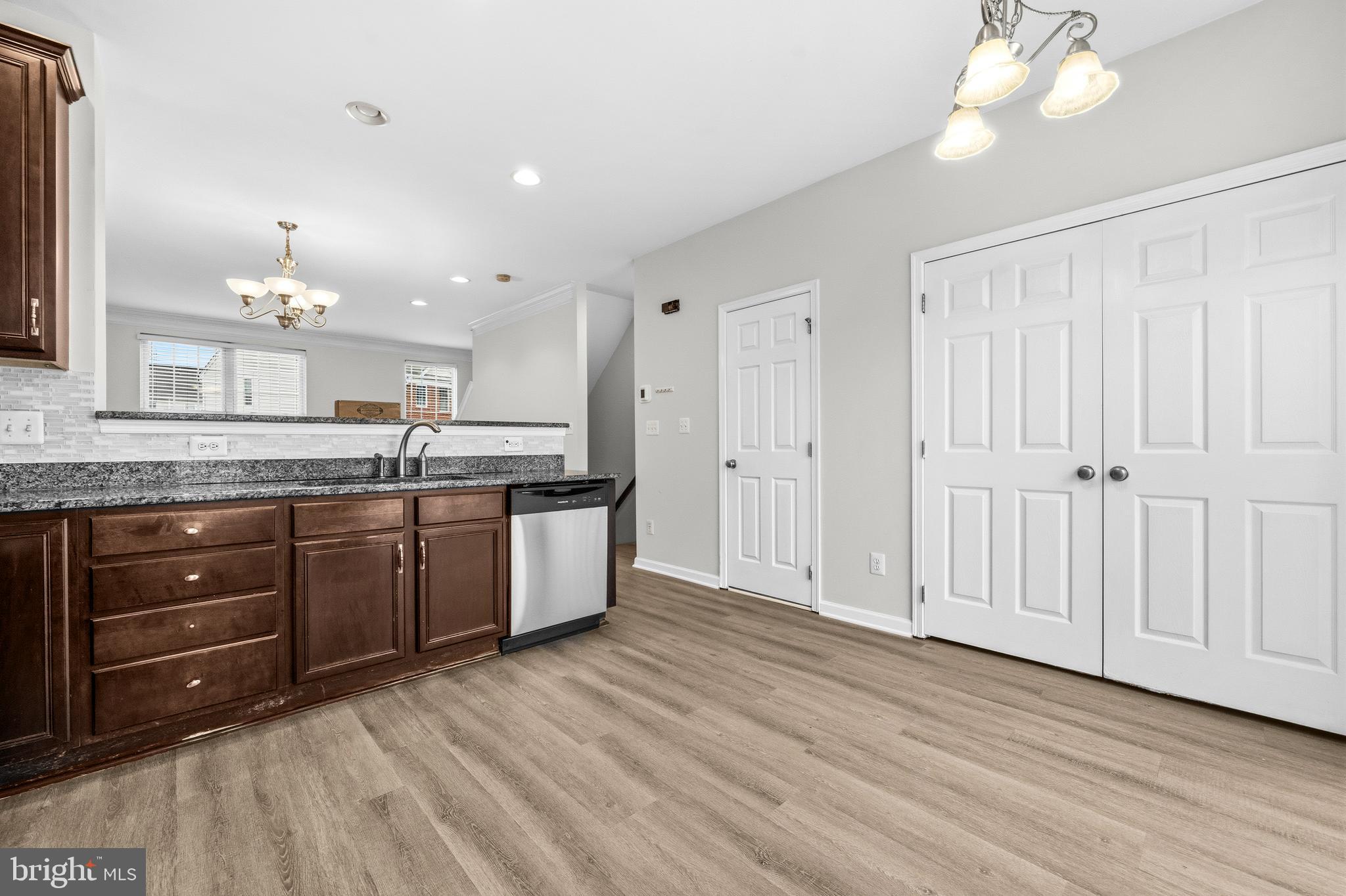 25154 Monteith Terrace Chantilly, VA 20152 - Photo 11 of 40 a kitchen with a sink cabinets and wooden floor