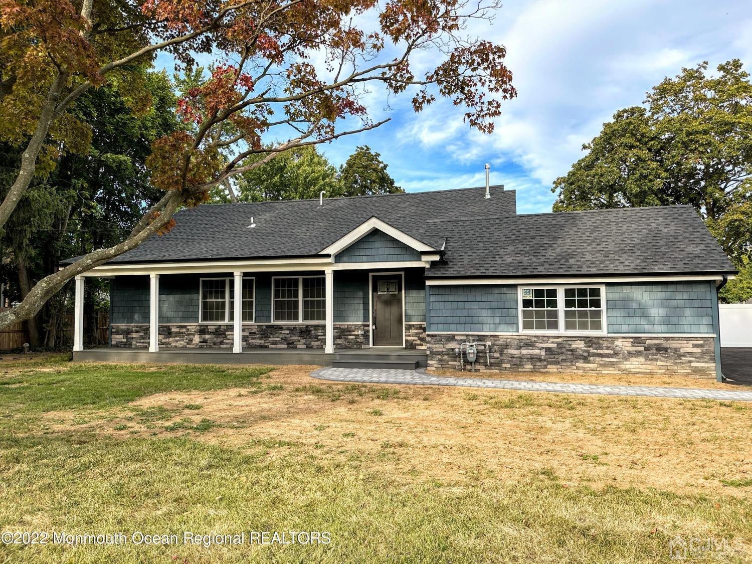 799 Highway 34 Matawan, NJ 07747 - Photo 1 of 11 a front view of a house with a garden