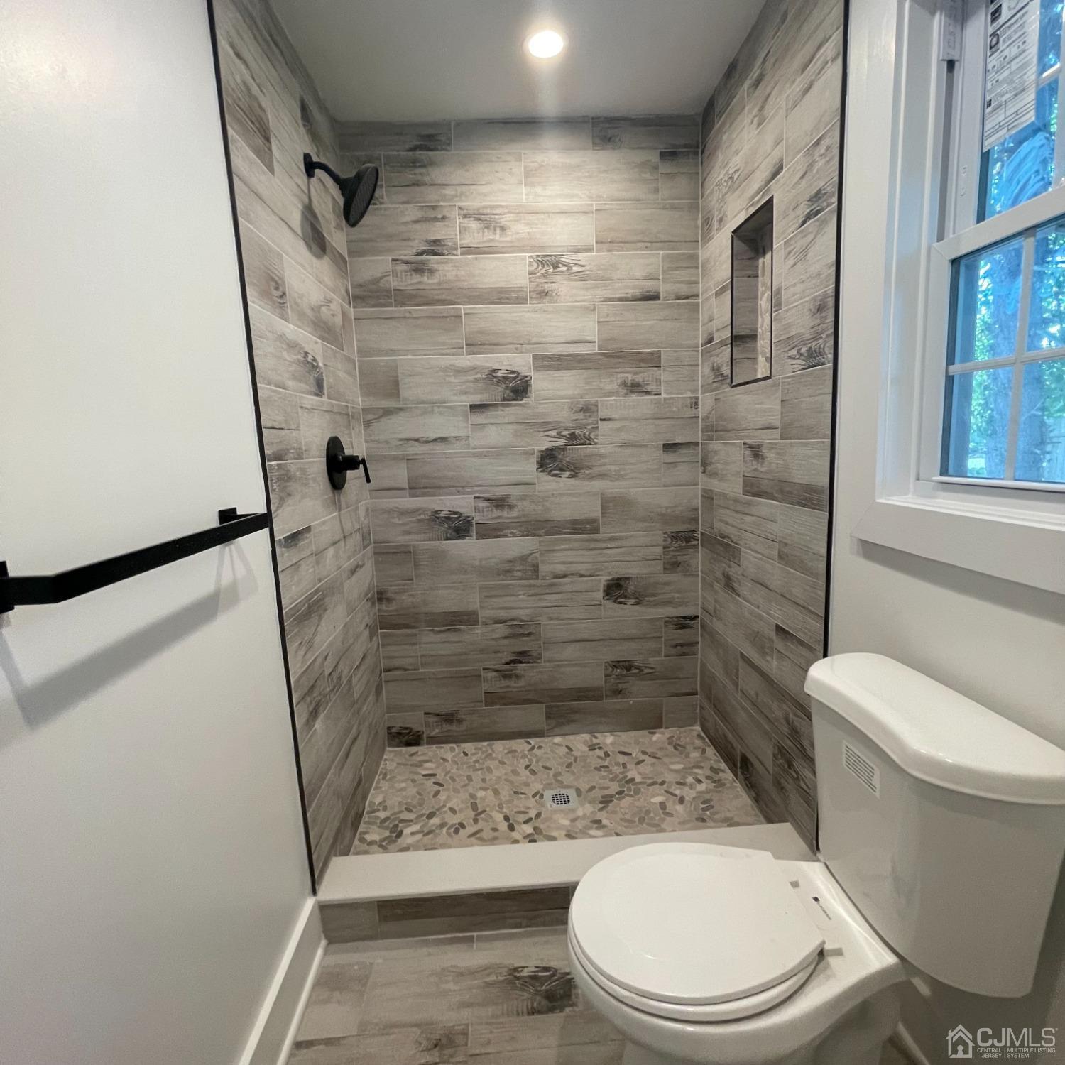799 Highway 34 Matawan, NJ 07747 - Photo 5 of 11 a bathroom with a toilet and a shower