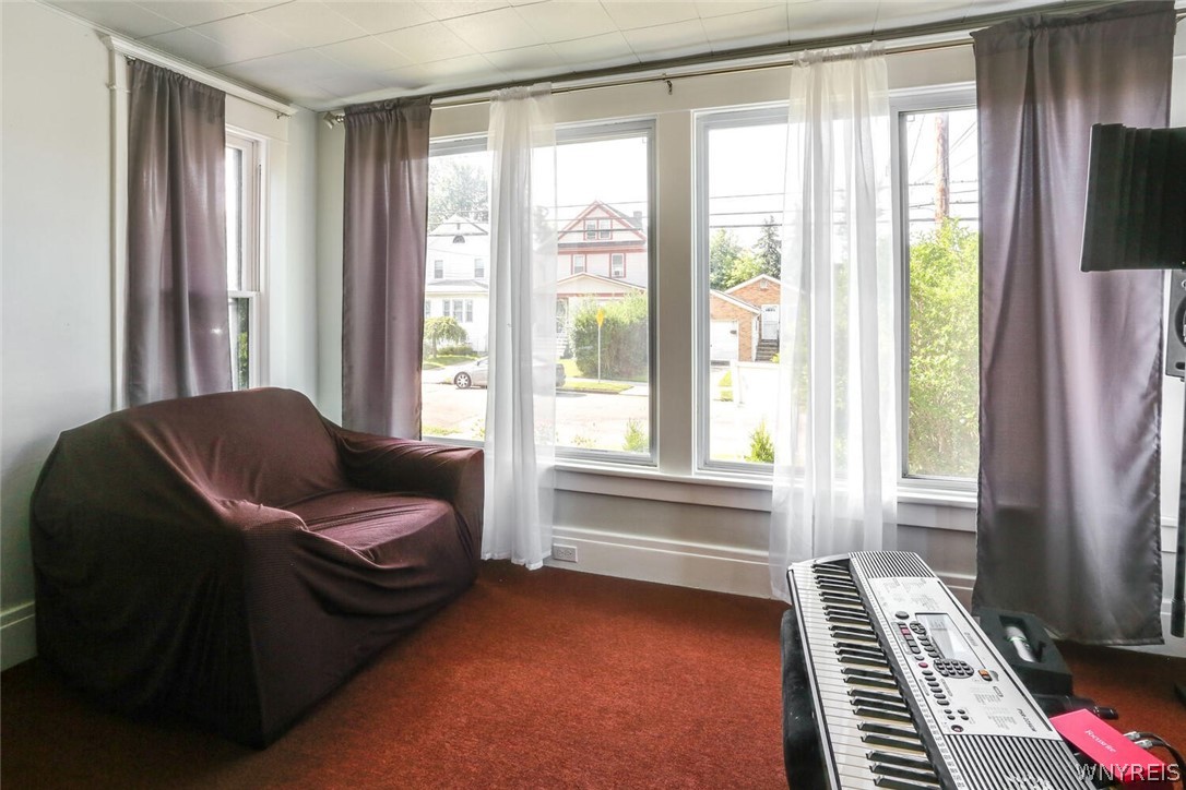 396 Highgate Avenue Buffalo, NY 14215 - Photo 4 of 27 Sun room 1st floor