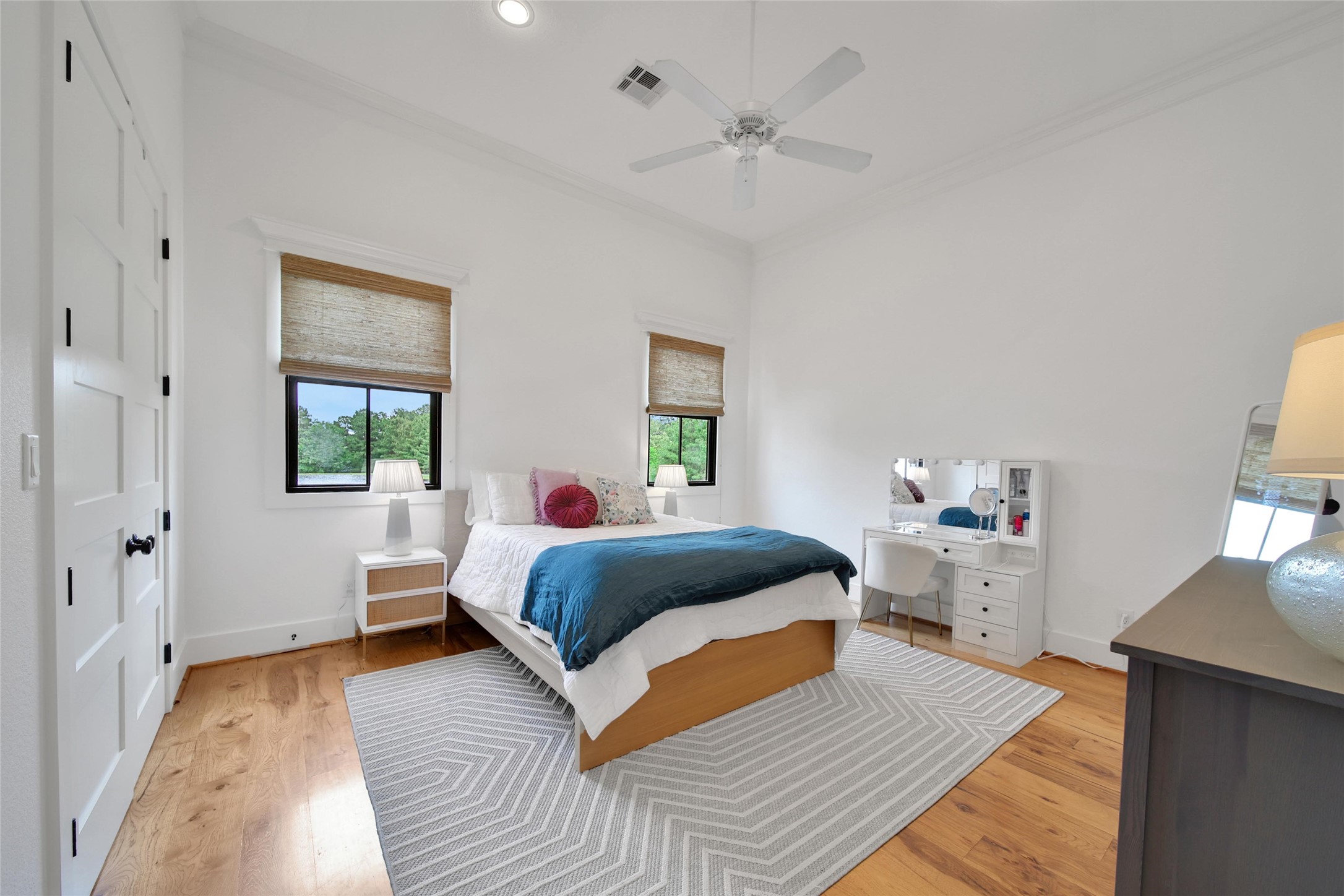 18875 Rabon Chapel Road Montgomery, TX 77316 - Photo 20 of 45 a bedroom with a bed and wooden floor