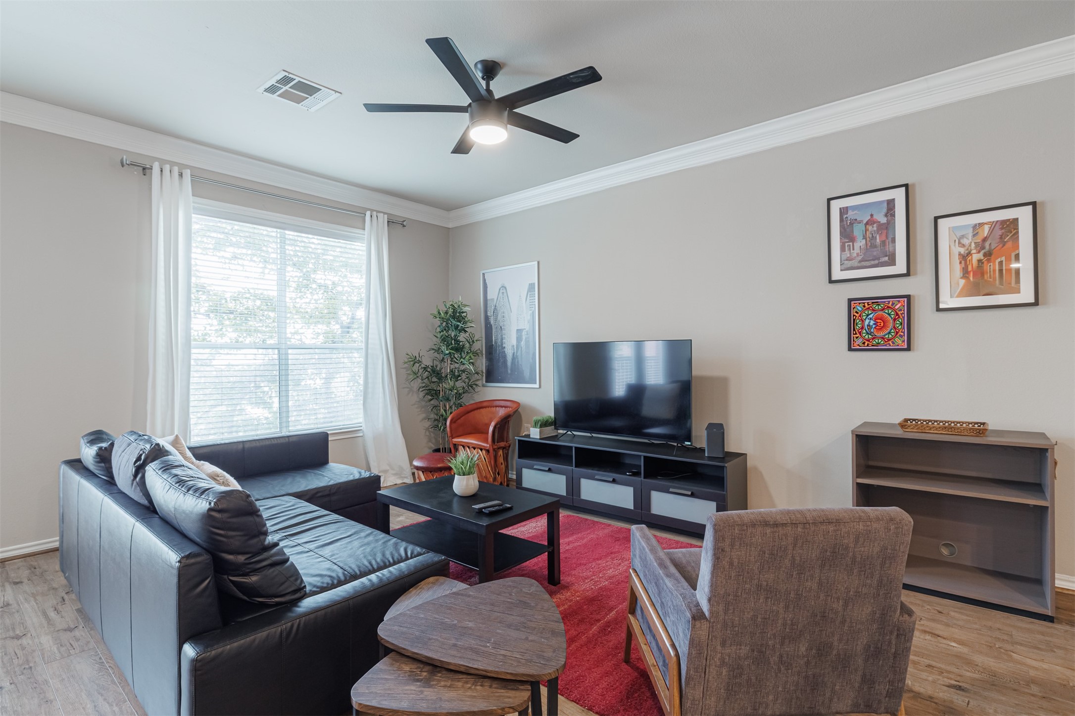 2400 McCue Road, Unit 308 Houston, TX 77056 - Photo 2 of 24 a living room with furniture and a flat screen tv