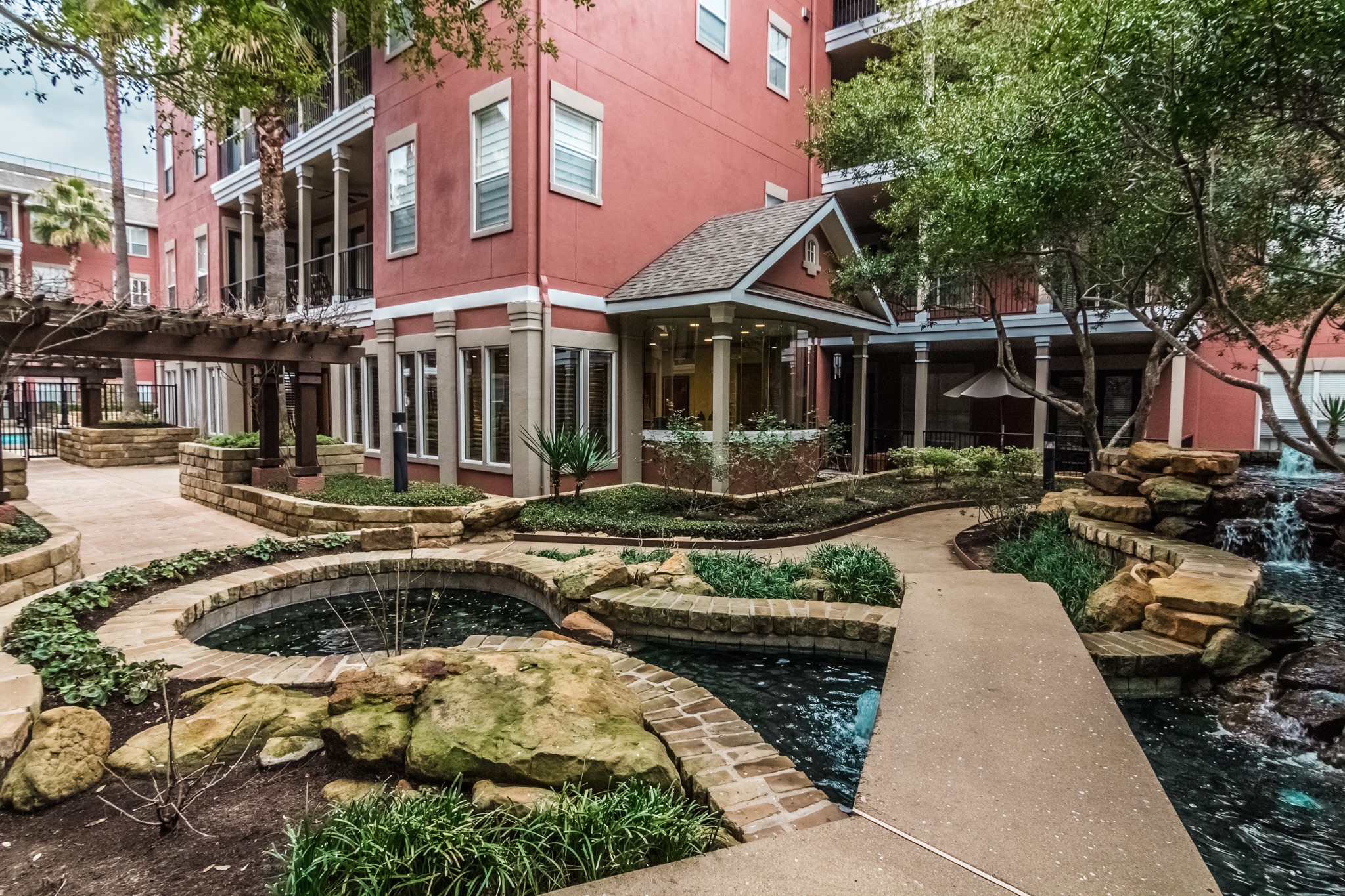 2400 McCue Road, Unit 308 Houston, TX 77056 - Photo 21 of 24 a front view of a house with swimming pool