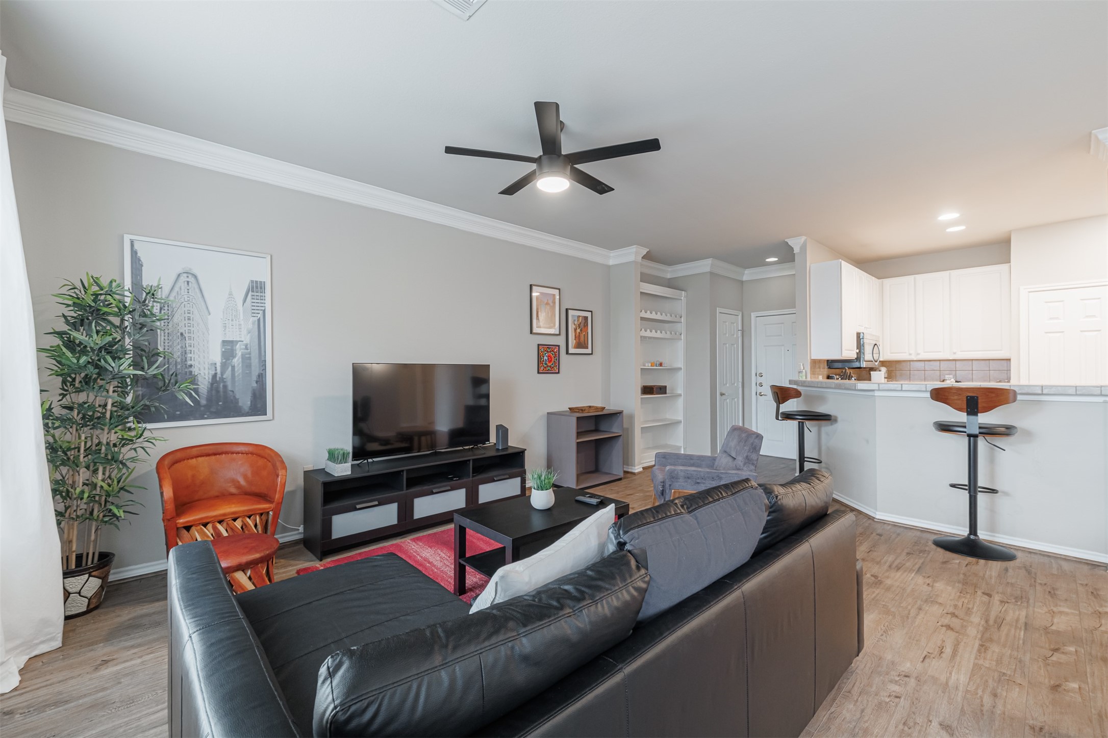 2400 McCue Road, Unit 308 Houston, TX 77056 - Photo 3 of 24 a living room with furniture and a flat screen tv