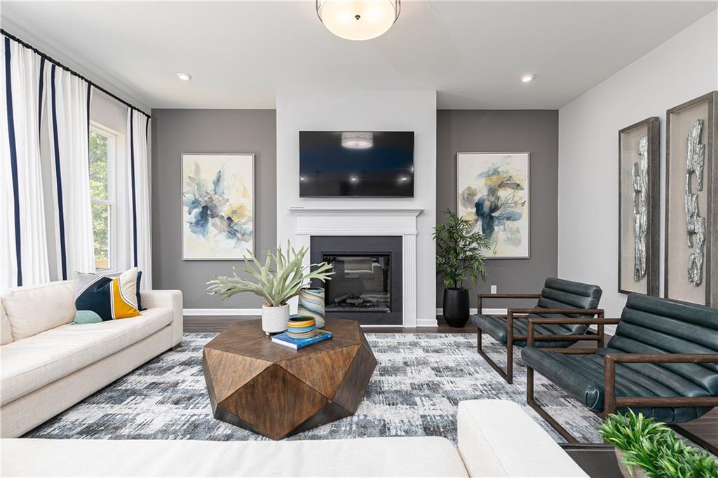 337 Brighton Bnd Lane Acworth, GA 30102 - Photo 11 of 83 a living room with furniture a flat screen tv and a fireplace