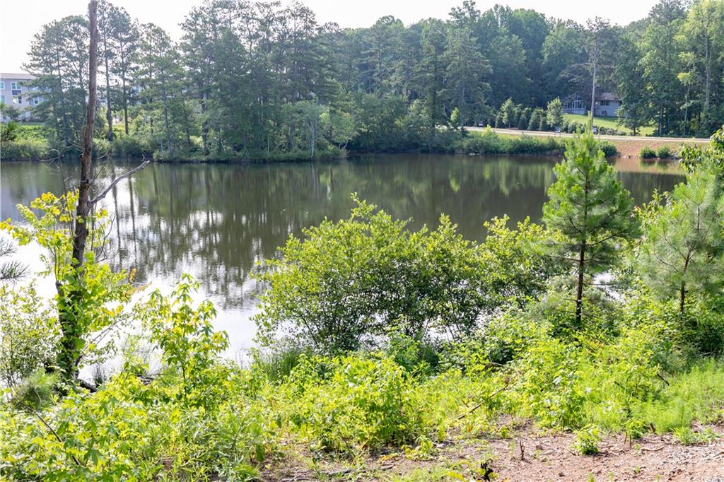 337 Brighton Bnd Lane Acworth, GA 30102 - Photo 40 of 83 a view of a lake with a house in the background