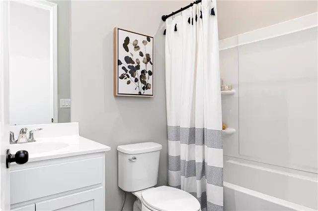 a bathroom with a toilet and a sink