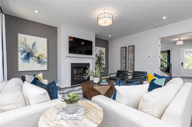 a living room with furniture fireplace and a flat screen tv