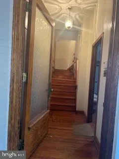 a view of entryway with wooden floor