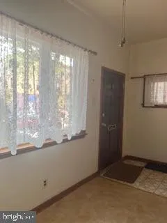 a view of water heater room with window