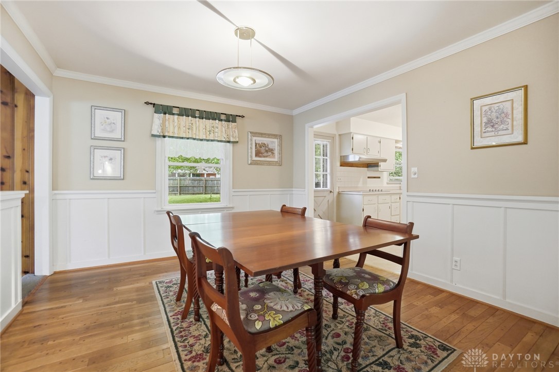 6119 Flemington Road Dayton, OH 45459 - Photo 11 of 76 This inviting dining room offers a harmonious blend of classic design and a warm atmosphere.
