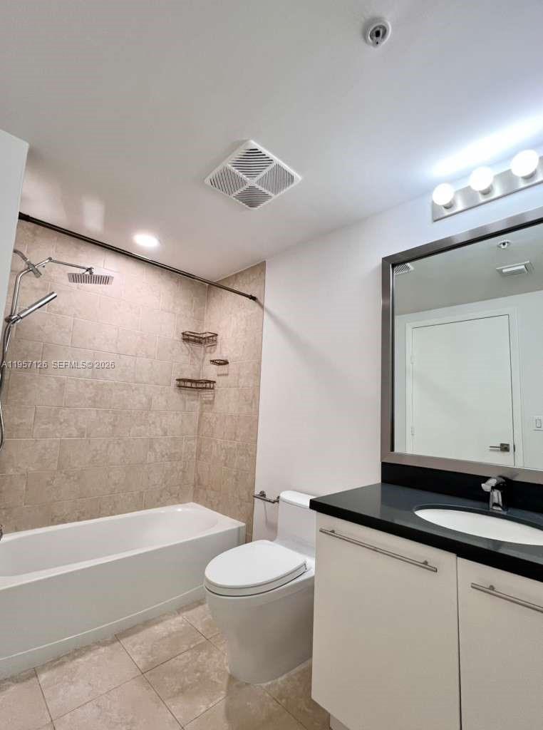 90 Southwest 3rd Street, Unit TH300A Miami, FL 33130 - Photo 16 of 21 a bathroom with a sink a toilet and a bathtub