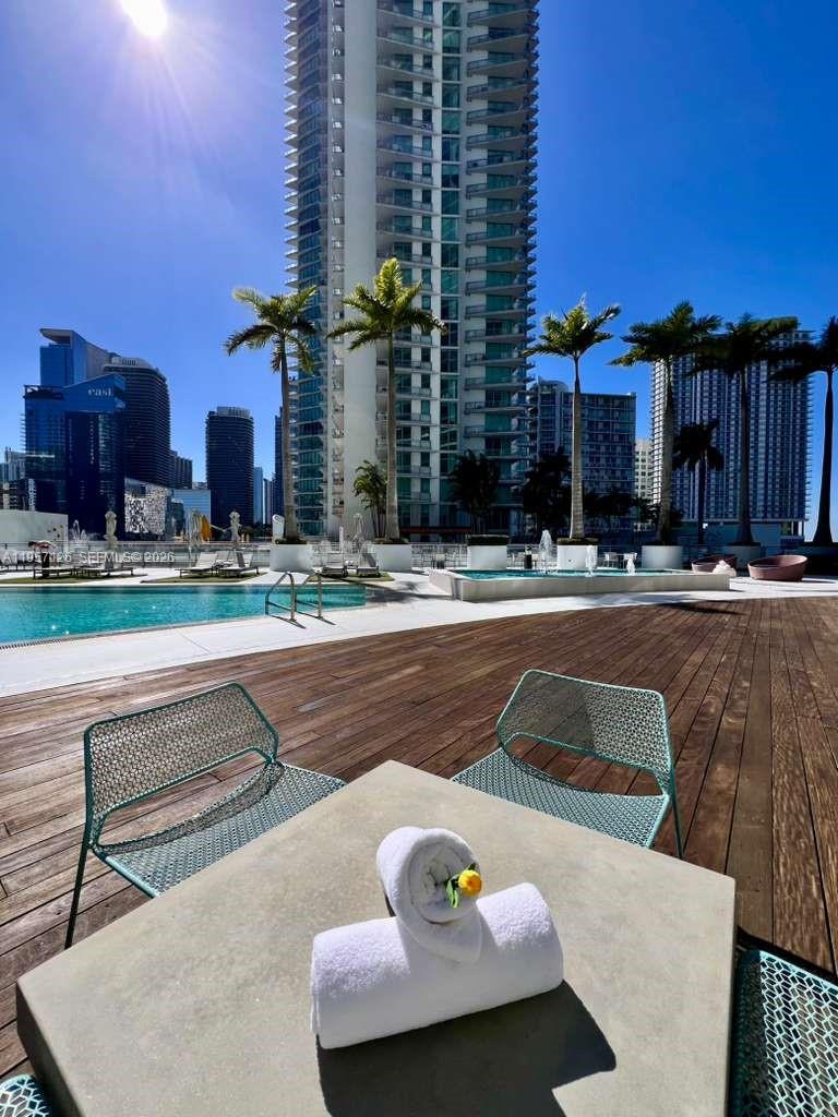 90 Southwest 3rd Street, Unit TH300A Miami, FL 33130 - Photo 21 of 21 a view of a patio with couches and table and chairs