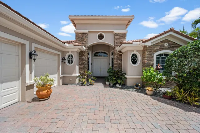 a front view of a house with outdoor seating