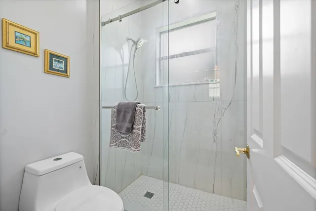 a bedroom with two beds and a dresser