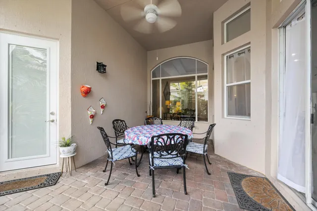 a view of a chairs and table in a patio