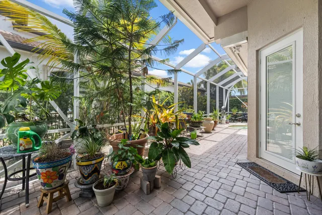 a house view with a swimming pool and outdoor seating