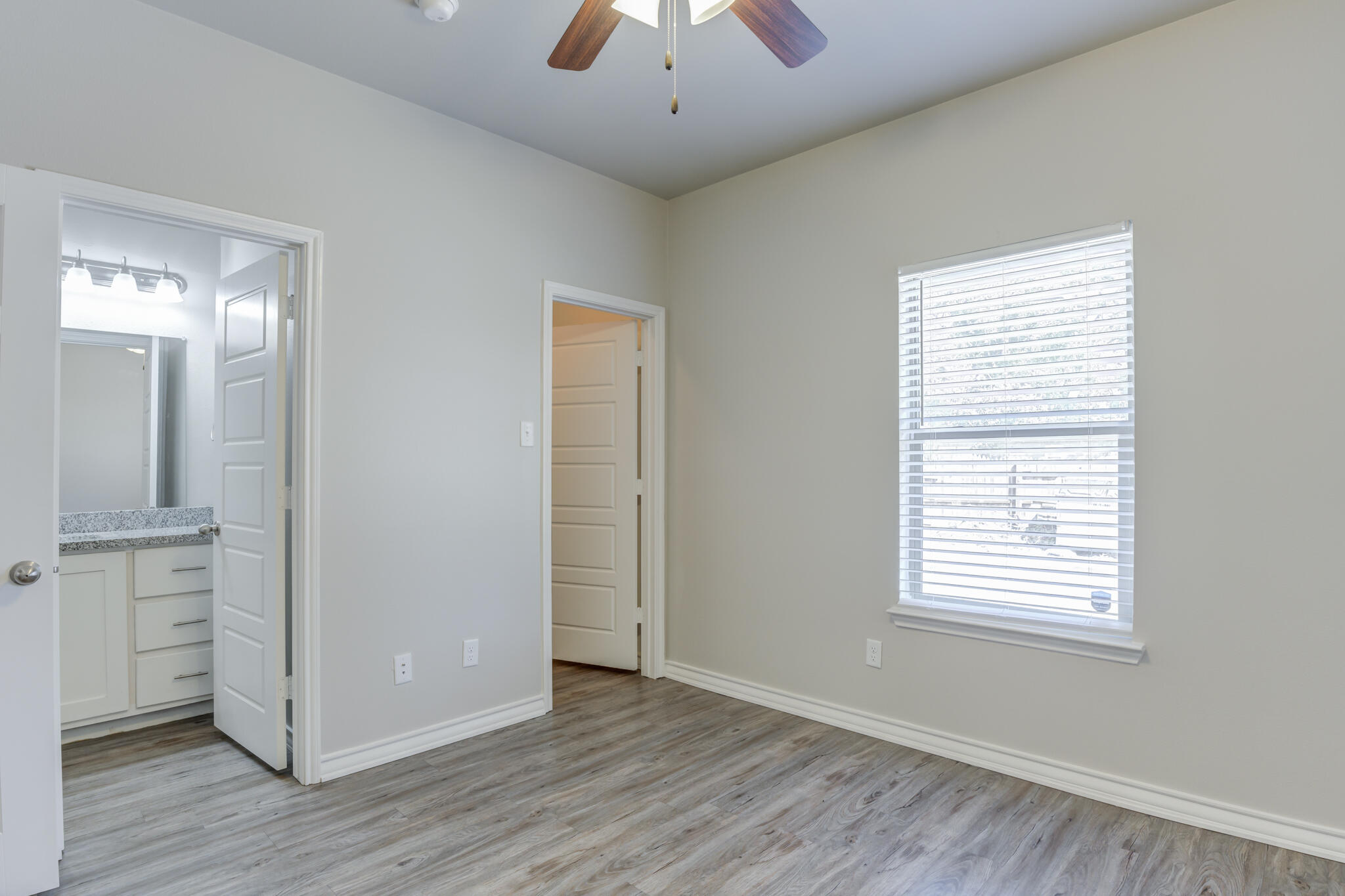 3404 25th Street Lubbock, TX 79410 - Photo 25 of 38 a view of an empty room with wooden floor and a window