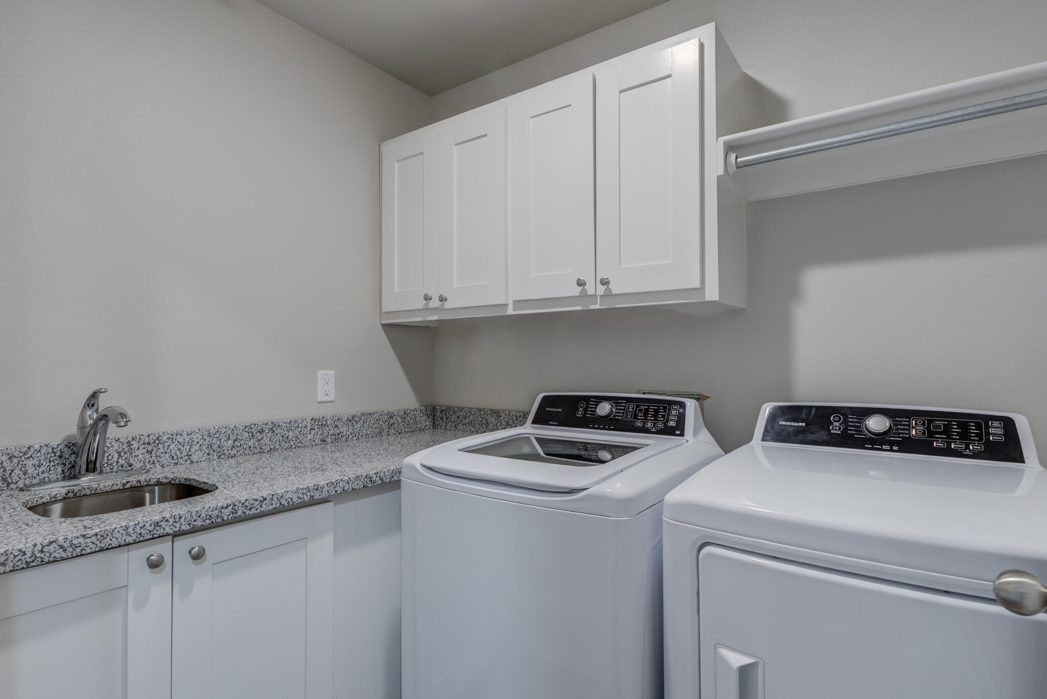3404 25th Street Lubbock, TX 79410 - Photo 28 of 38 a utility room with sink dryer and washer