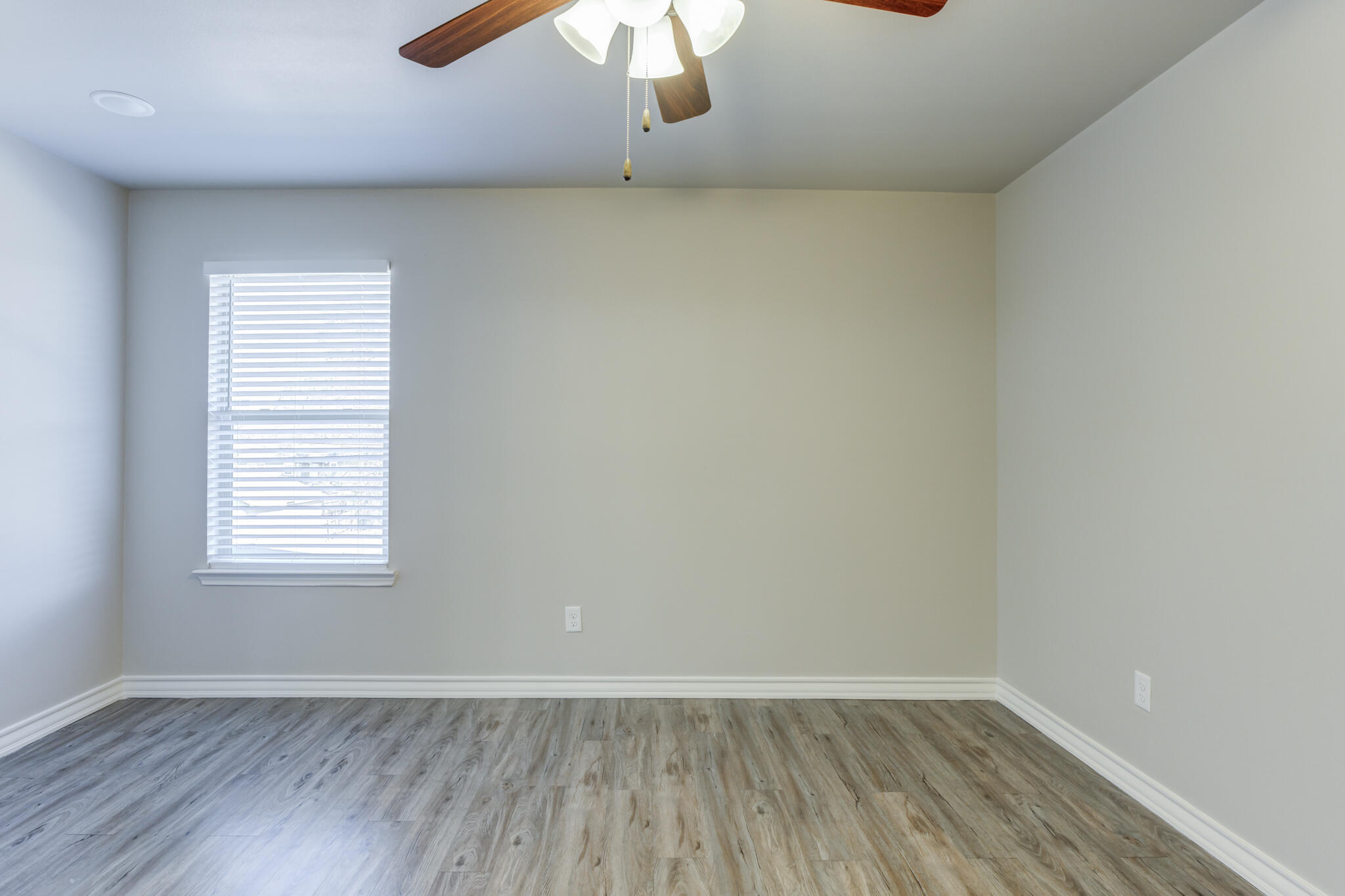 3404 25th Street Lubbock, TX 79410 - Photo 29 of 38 an empty room with wooden floor and windows