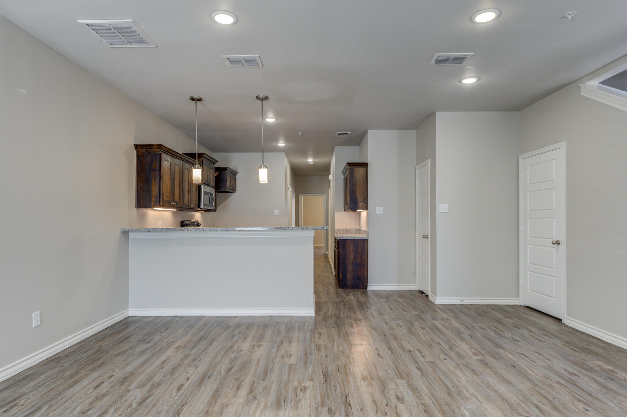 3404 25th Street Lubbock, TX 79410 - Photo 3 of 38 a view of kitchen with wooden floor