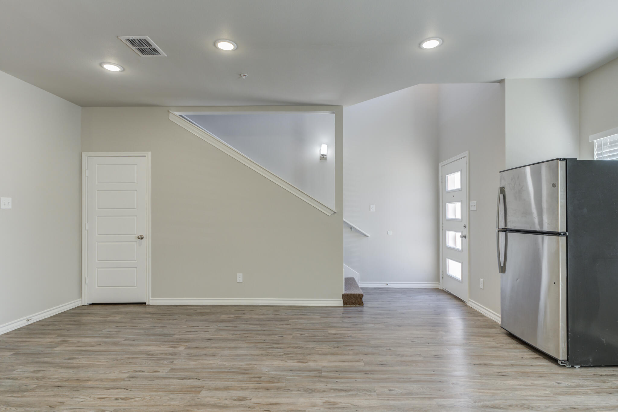 3404 25th Street Lubbock, TX 79410 - Photo 5 of 38 a view of a livingroom with a staircase
