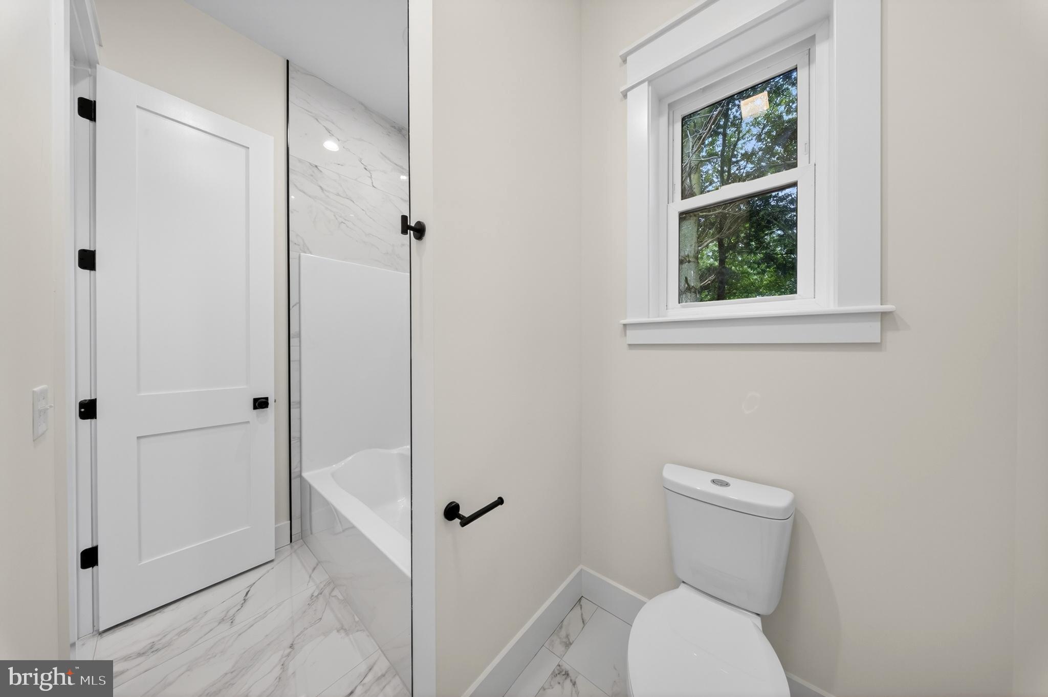 14133 Pepperbox Road Delmar, DE 19940 - Photo 43 of 59 a bathroom with a toilet and a shower