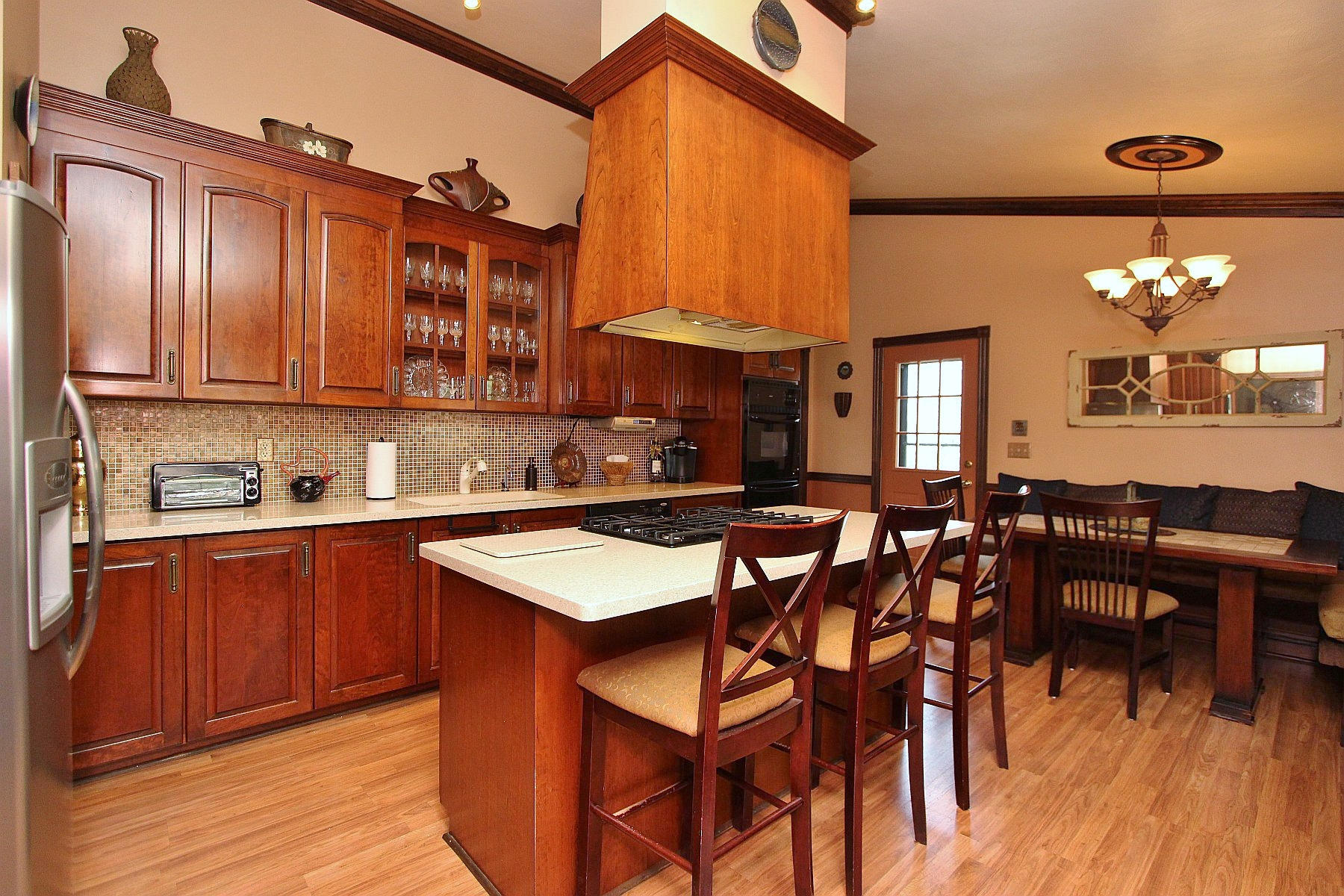 1282 Sunny Ridge Road Northeast Floyd, VA 24091 - Photo 14 of 53 a kitchen with cabinets a sink dishwasher a dining table and chairs with wooden floor