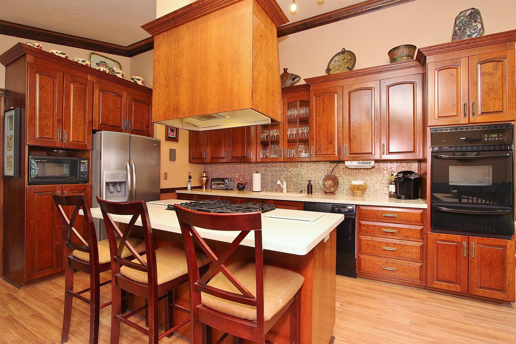 1282 Sunny Ridge Road Northeast Floyd, VA 24091 - Photo 15 of 53 a kitchen with stainless steel appliances granite countertop a stove top oven a refrigerator a sink and dishwasher with wooden floor